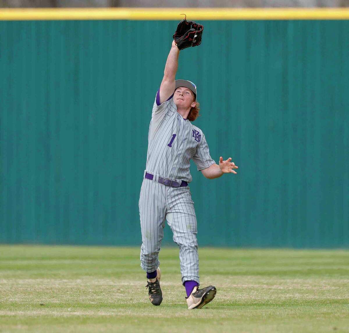 Montgomery right fielder Tyler Pelton (1) catches a fly ball in the third inning of a high school baseball game during the Brenham/Montgomery Tournament, Friday, March 4, 2022, in Montgomery.