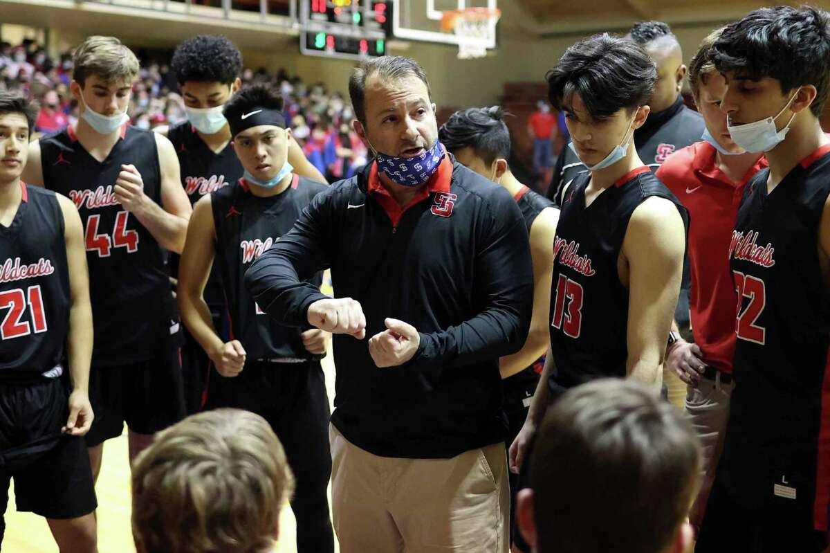 St. Ignatius boys basketball coach Jason Greenfield talks with his team.
