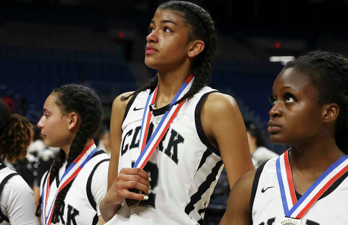 Clark's Arianna Roberson (center) shows her emotions after the team loses to DeSoto in the UIL Class 6A girls basketball semifinal game at the Alamodome on Friday, Mar. 4, 2022. Clark's run in the state tournament ended with a 56-47 loss to DeSoto.