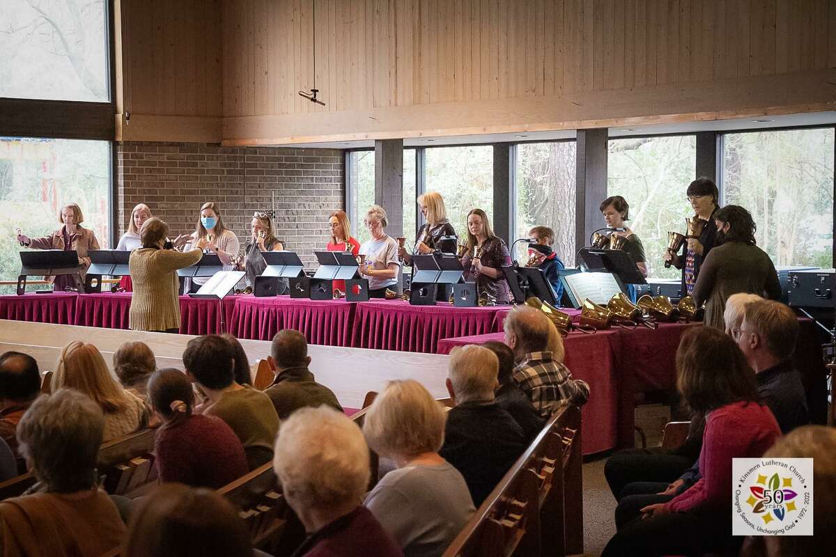 Director Lynnae Schatz directs the Kinsmen Ringers handbell choir during Kinsmen Lutheran Church's 50th anniversary celebration the weekend of Feb. 26, 2022.