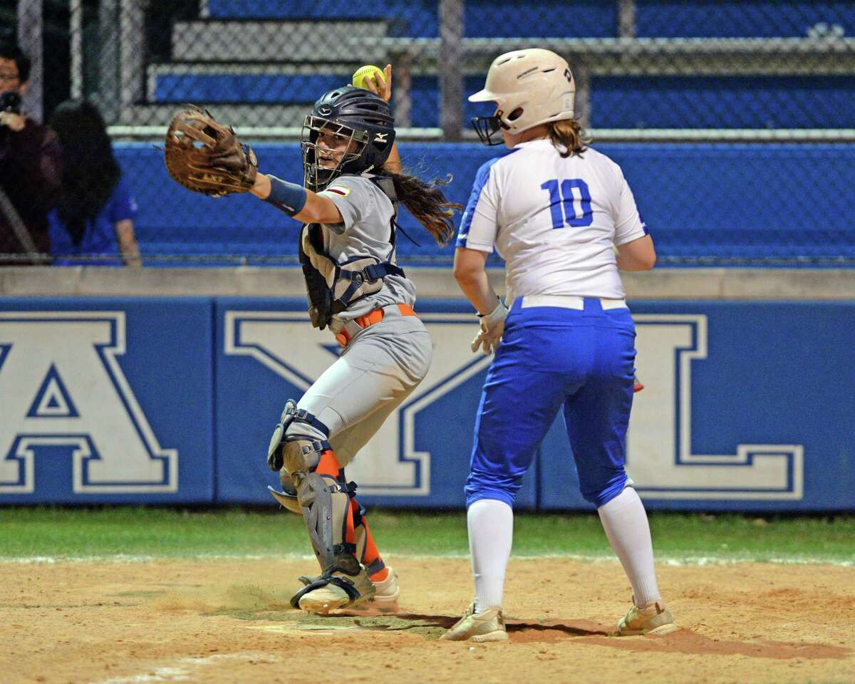 Catcher Emma Wingate (8) of Seven Lakes attempts a pickoff during the fourth inning of a 6A Region III District 19 softball game between the Seven Lakes Spartans and the Taylor Mustangs on Friday, March 4, 2022 at Taylor HS, Katy, TX.