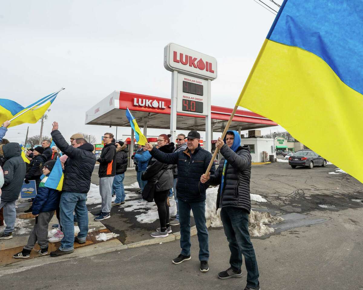 Mykhailo Olynyk and Volodymyr Labiak protest the Lukoil gas station on Second Avenue in Watervliet on Saturday, March 5, 2022, in support of the Ukrainian people. Some have noted that boycotting Lukoil stations hurts independent franchise owners, making them unwitting victims of a far-away geopolitical conflict. With Congress under pressure to ban Russian oil imports, Lukoil on Thursday seemingly rebuked Putin by calling for "the immediate cessation of the armed conflict." (Jim Franco/Special to the Times Union)
