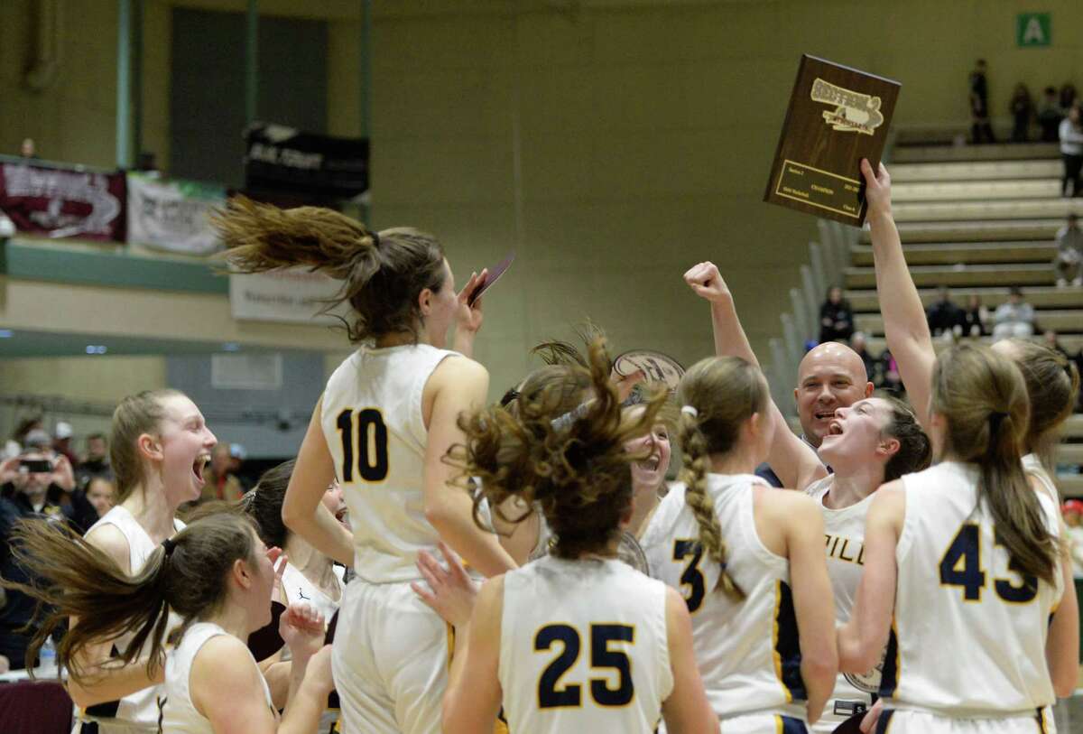 Averill Park girls' basketball players rally around the Section II Champions plaque following their victory over Burnt Hills-Ballston Lake in the Class A Championship on Saturday, Mar. 5, 2022 at Hudson Valley Community College in Troy, N.Y. (Jenn March, Special to the Times Union)