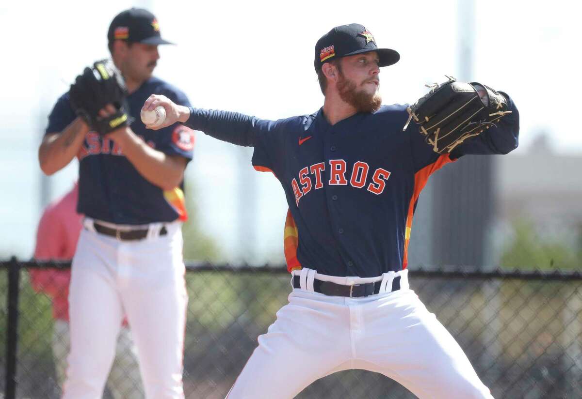 Houston Astros pitcher Shawn Dubin (75) pitches during at bullpen session at spring training workouts for the Astros at Ballpark of the Palm Beaches in West Palm Beach, Florida, Saturday, February 27, 2021.