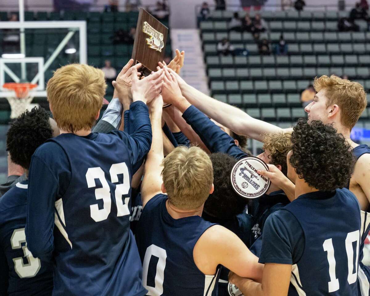 Mekeel Christian Academy celebrates after beating Gloversville in the Section II, Class A finals at the Cool Insuring Arena in Glens Falls on Saturday, March 5, 2022. (Jim Franco/Special to the Times Union)