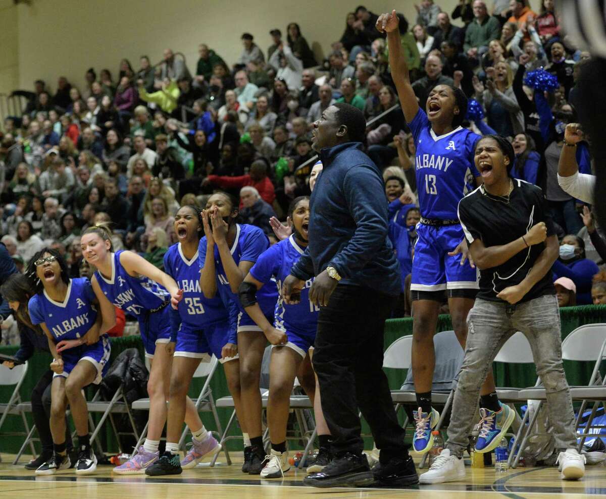 Albany players and coaches react to a 3-point basket made on the court against Shenendehowa during the Class AA Championship on Saturday, Mar. 5, 2022 at Hudson Valley Community College in Troy, N.Y. (Jenn March, Special to the Times Union)