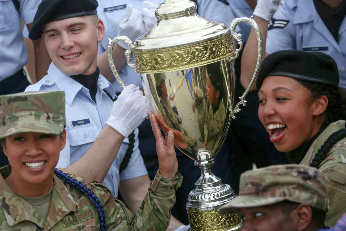 Members of the 81st Training Wing at Keesler AFB hold up their first-place trophy after winning the 37th Training Wing Invitational Drill Down at at JBSA-Lackland on Saturday, March 5, 2022. The competition showcased the teams’ precision and teamwork.