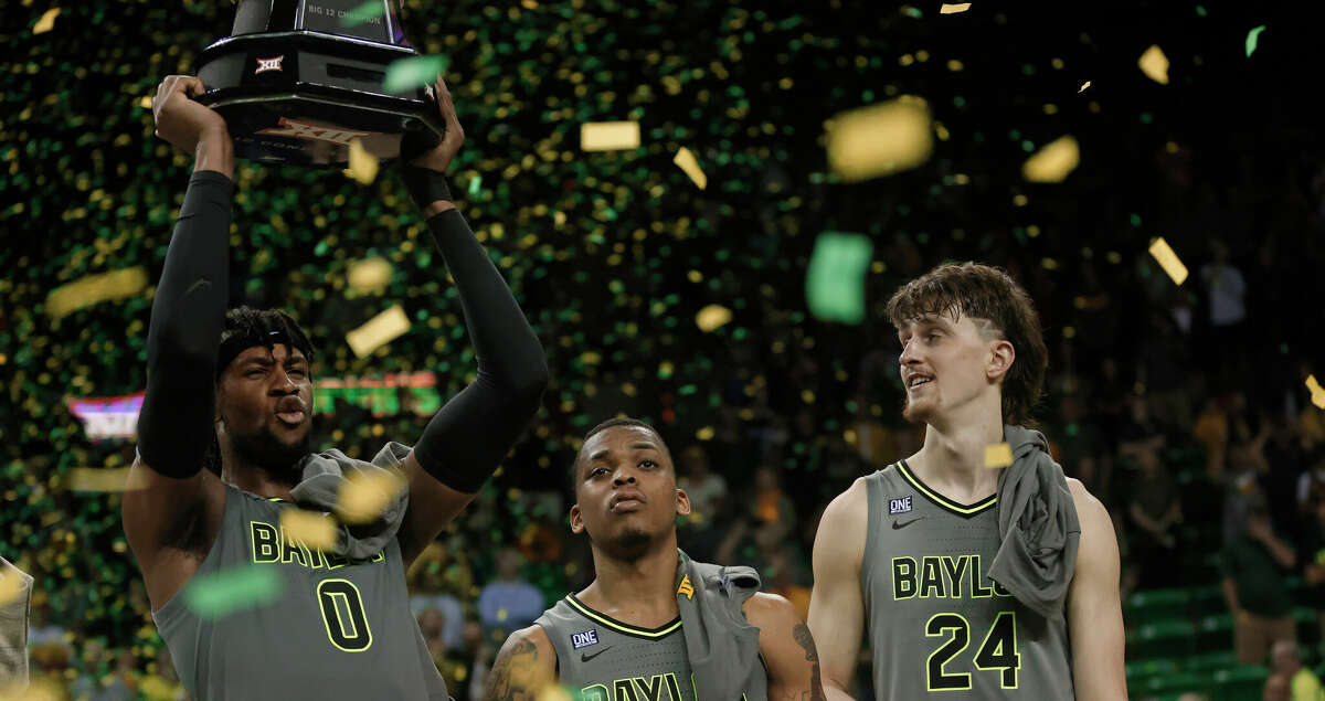 Flo Thamba #0, James Akinjo #11 and Matthew Mayer #24 of the Baylor Bears celebrate their 75-68 win over the Iowa State Cyclones at the Ferrell Center on March 5, 2022 in Waco, Texas. Baylor won a share of the Big 12 Championship with the win. (Photo by Ron Jenkins/Getty Images)
