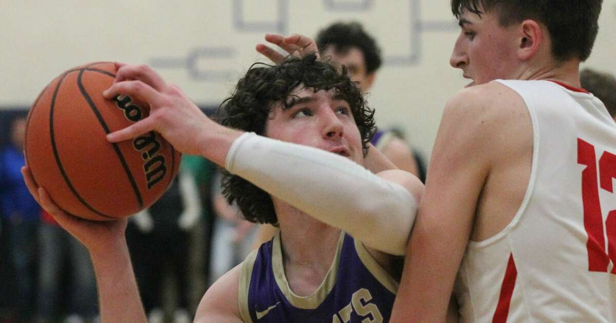 Routt's Braden Cors looks up at the basket against Liberty in the championship game of the North Greene Sectional Friday night in White Hall.