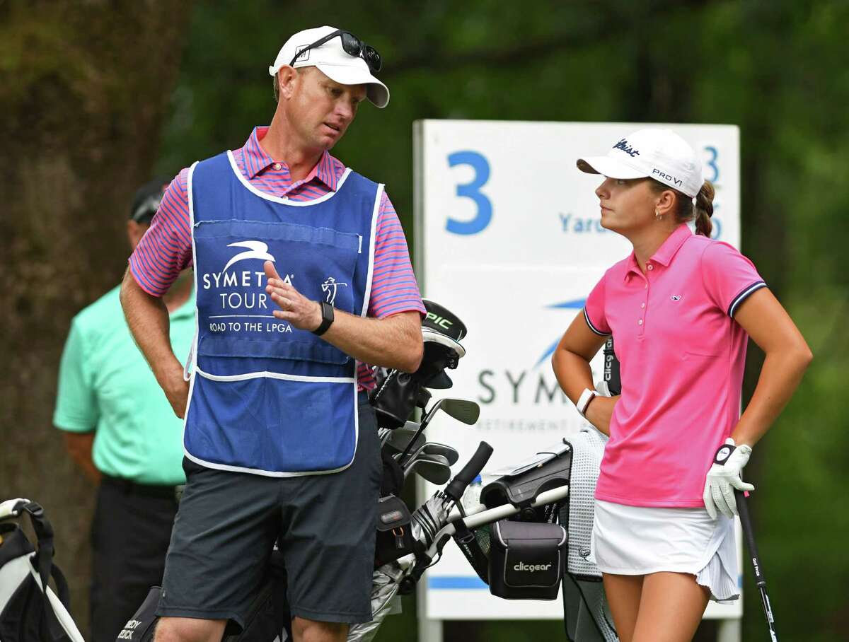 Kennedy Swedick, a 14-year-old from Altamont, talks to her caddy Anders Mattson during the first round of the Symetra Tour's Twin Bridges Championship at Pinehaven Country Club on Friday July 23, 2021 in Guilderland, N.Y. Mattson is also one of her teachers. (Lori Van Buren/Times Union)