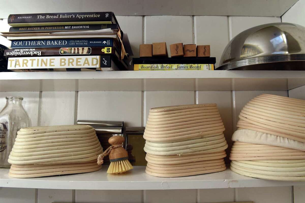A variety of bannetons or proofing baskets used in bread making line a shelf at Stefanie Reichert's home in Killingworth on March 4, 2022.
