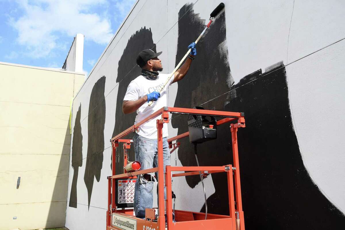 Beaumont native Henry Smith, who moved to Los Angeles about four years ago, is among the artists featured in last weekend's inaugural Mural Fest in Beaumont. Smith has been a mural success story in his new home and created a piece on the wall outside the Barber's Trade School on Orleans Street downtown. Photo made Thursday, March 3, 2022 Kim Brent/The Enterprise
