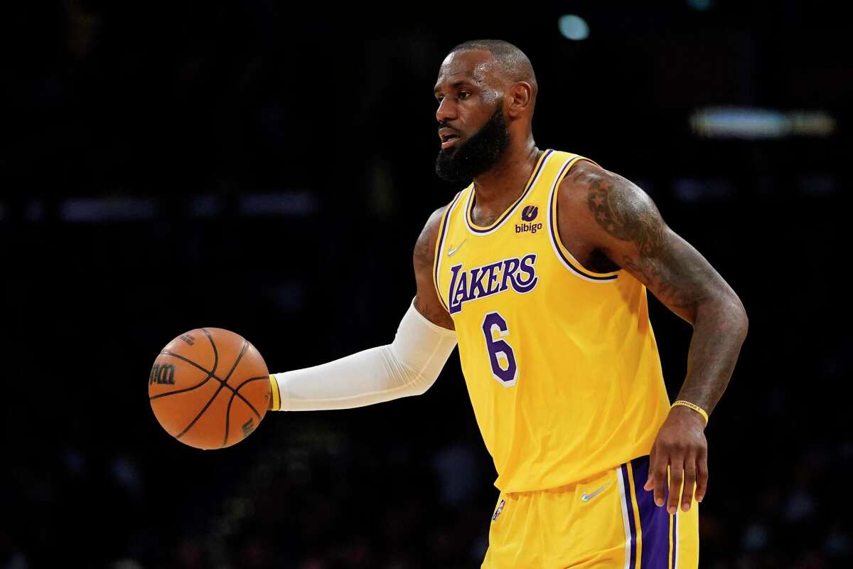 Los Angeles Lakers forward LeBron James (6) controls the ball during the first half of an NBA basketball game against the Golden State Warriors in Los Angeles, Saturday, March 5, 2022. (AP Photo/Ashley Landis)