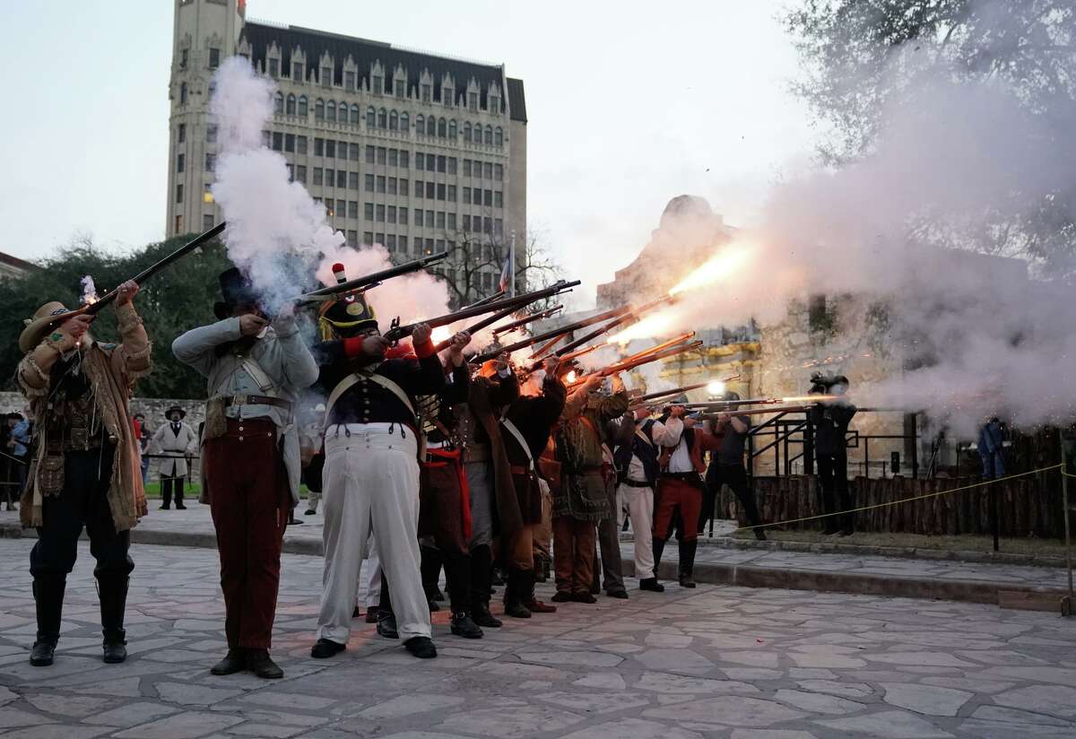 Muskets fire during the annual "Dawn at the Alamo" ceremony Sunday to commemorate the March 6, 1836, battle.