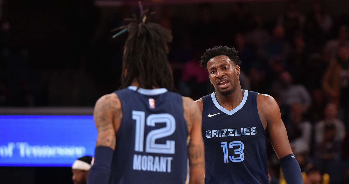 Jaren Jackson Jr. #13 of the Memphis Grizzlies and Ja Morant #12 of the Memphis Grizzlies during the game against the Minnesota Timberwolves at FedExForum on January 13, 2022 in Memphis, Tennessee. (Photo by Justin Ford/Getty Images)