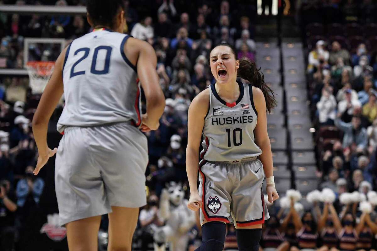 UConn’s Nika Muhl (10) reacts toward teammate Olivia Nelson-Ododa during a Big East Tournament semifinal against Marquette on March 6.