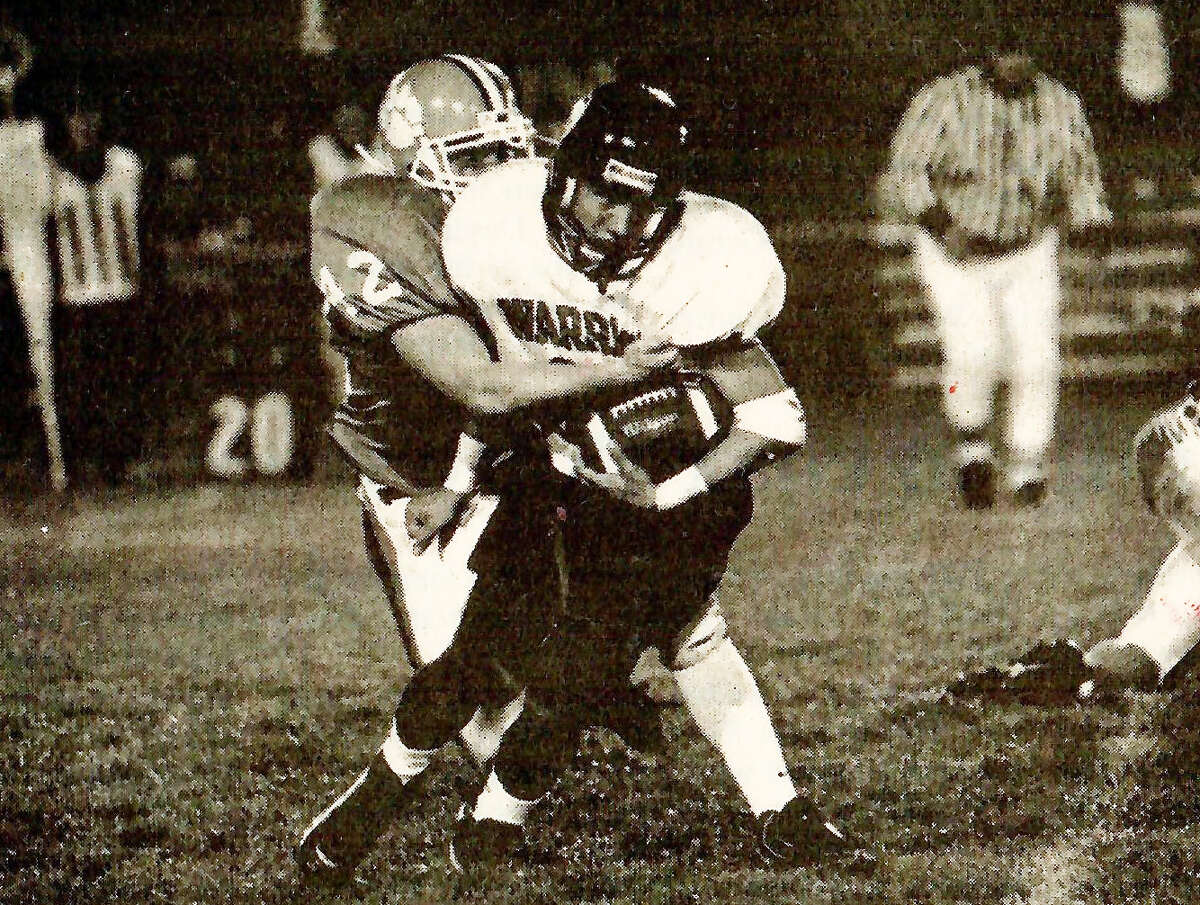 Edwardsville’s Preston Foehrkalb, right, takes down a Granite City ball carrier during his senior season at EHS in 1997.