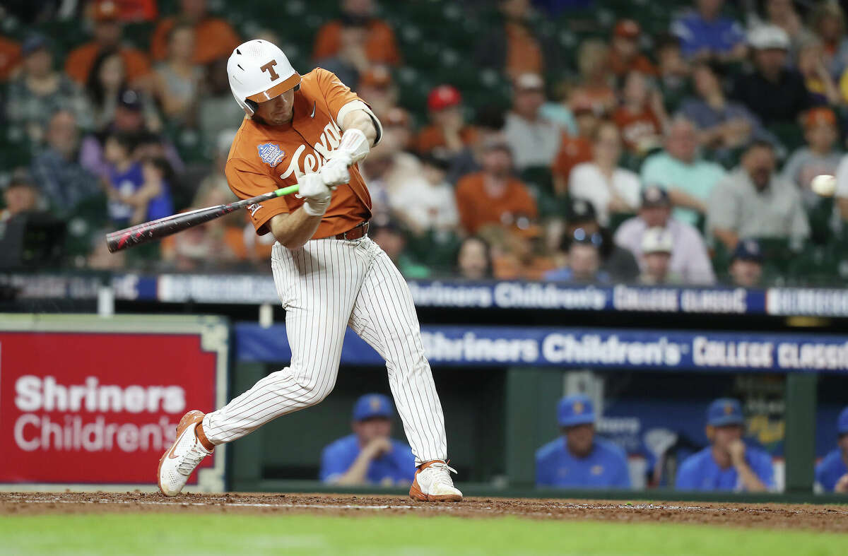 Texas infielder Ivan Melendez (17) connects for a solo home run in the fifth inning against UCLA during the Shriners Children's College Classic at Minute Maid Park on Sunday, March 6, 2022 in Houston.
