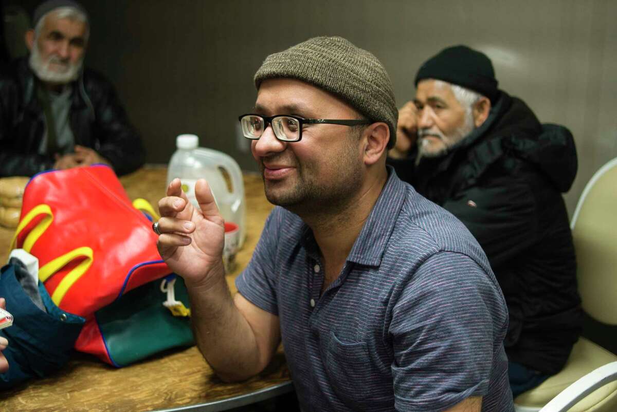 Afghan refugee, Alireza Reza, talks about his experiences since leaving Afghanistan on Sunday, March 7, 2022, in Albany, N.Y. The Muslim Soup Kitchen has been feeding people newly arrived to the Albany area since November.