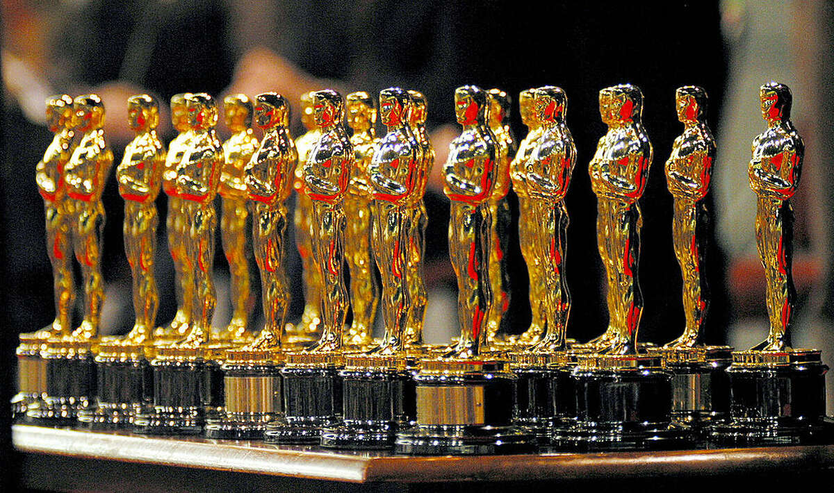 The 22 Oscars won by the Lord of The Rings sit on a table. (Photo credit Dean Treml/AFP via Getty Images)