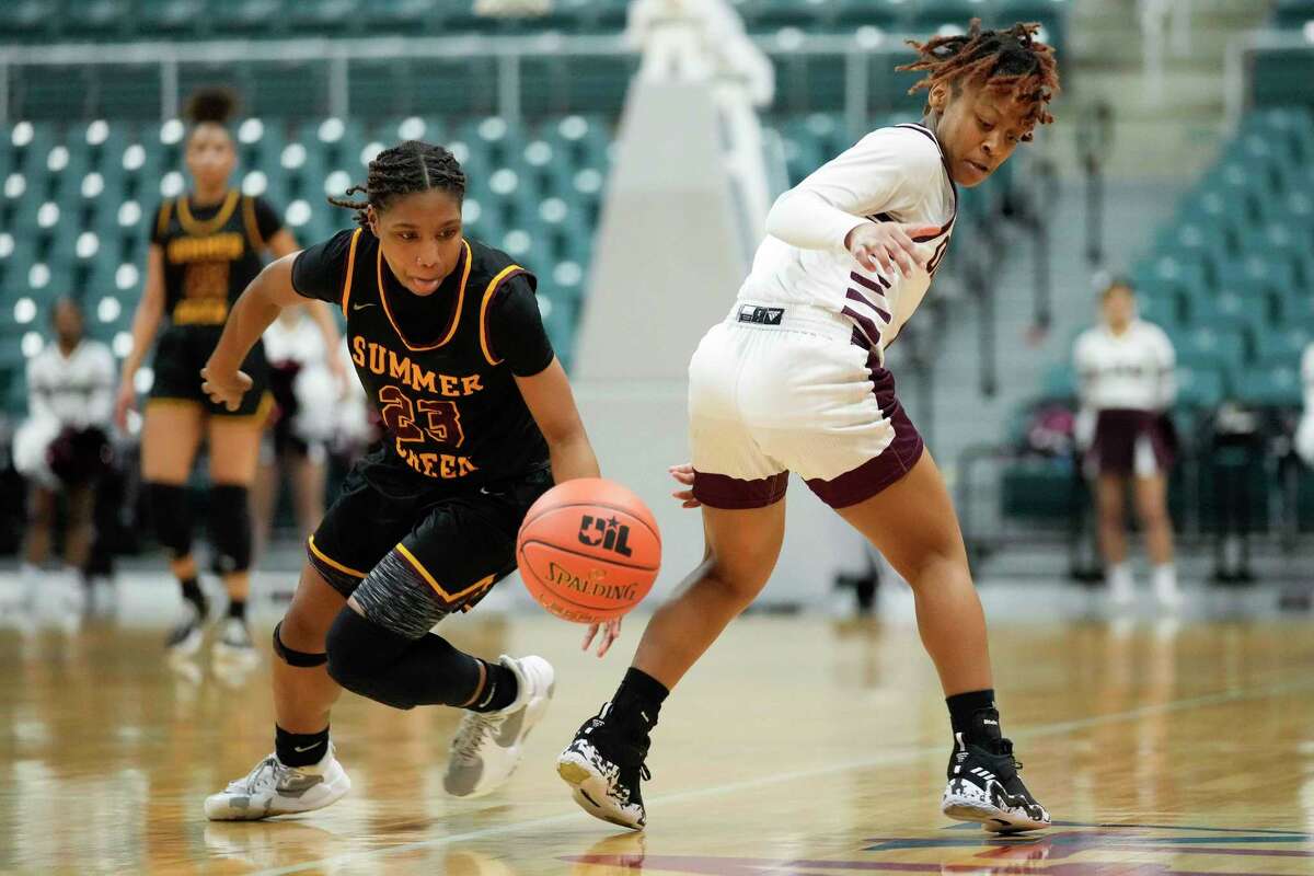 Summer Creek guard Anahlynn Murray, left, steals the ball from Pearland guard Paige Bonner during the first half of the Region III-6A high school basketball championship game, Saturday, Feb. 26, 2022, in Katy, TX.