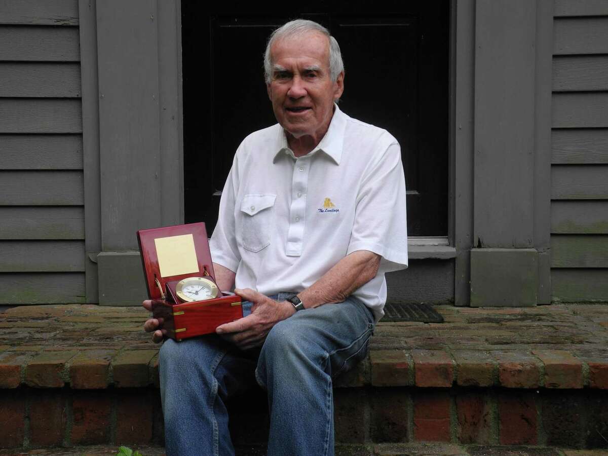 Jack Majesky, holding the clock given to him upon his retirement as executive director of the Wilton Community Emergency Response Team in 2020, will be inducted into the Wilton Schools Hall of Fame Class of 2022.