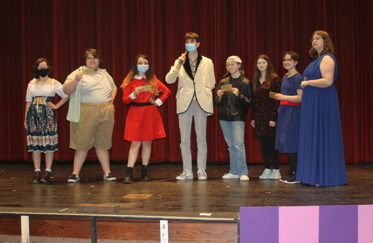 Pictured are the golden ticket winners and their guests from the Manistee Middle High School production of "Roald Dahl's Willy Wonka Jr." From left to right are Anna Herberger as Mrs. Gloop, Kaleb Shoemate as Augustus Gloop, Carson Eskridge as Veruca Salt, Dylan Madsen as Phineous Trout, Sarah Huber as Mike Teavee, Kayleigh Moore as Mrs. Teavee, Cady Brown as Violet Beauregarde and Brenna Lind as Mrs. Beauregarde.