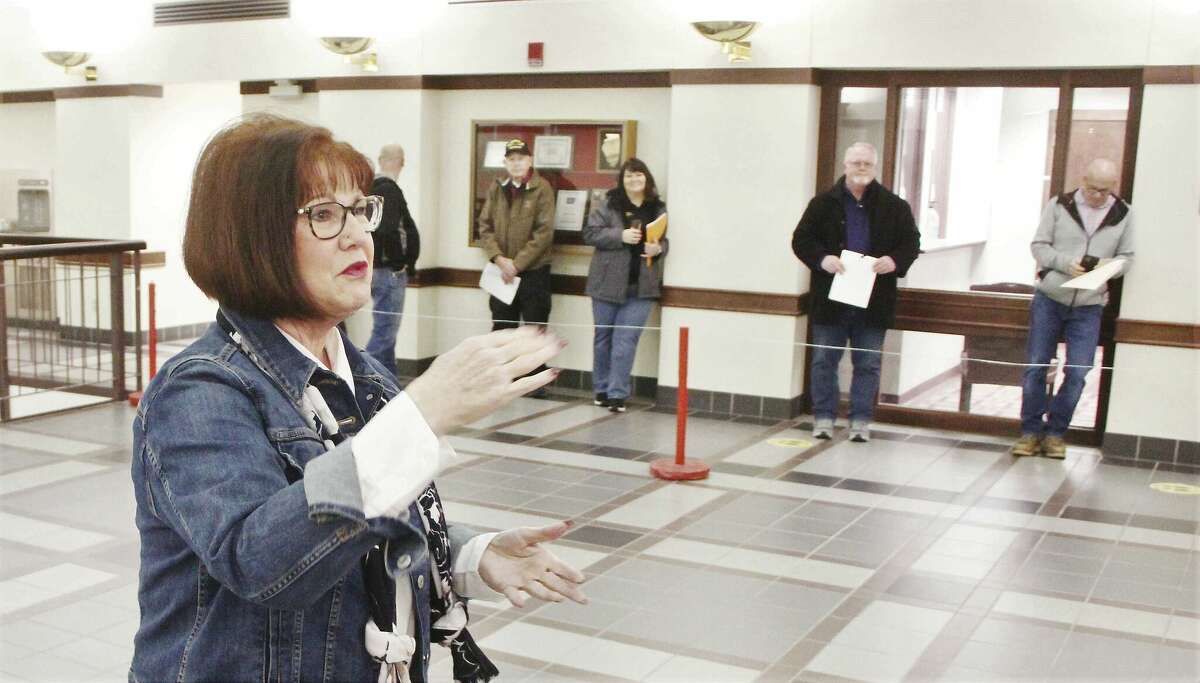 Madison County Clerk Debra Ming-Mendoza gives instructions to people waiting in line to file nominating petitions for the upcoming June primary. About 30 people were in line to file when the County Clerk's office opened at 8:30 a.m., meaning they are all considered filing at the same time. Filing continues through 5 p.m. Monday, March 14.
