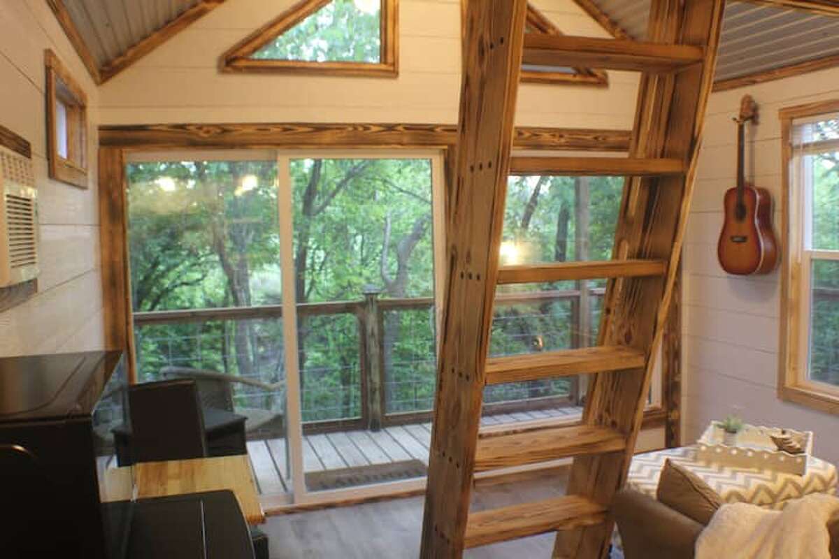The treehouse is located alongside a creek in a 300-acre farm. 