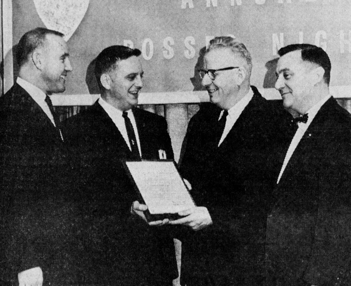 The highlight of the annual Manistee Jaycees Bosses Night held last evening at the Hotel Chippewa came when President Ken Larson presented the Outstanding Boss plaque to Edwin Hokanson, local camera store proprietor, for his record of community service. The photo was published in the News Advocate on March 9, 1962.