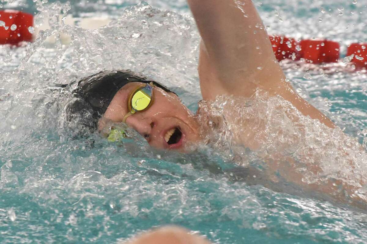 Mike Kvashchuk of the Norwalk/McMahon co-op competes in the 100 freestyle during the FCIAC boys swimming finals on Thursday in Greenwich.
