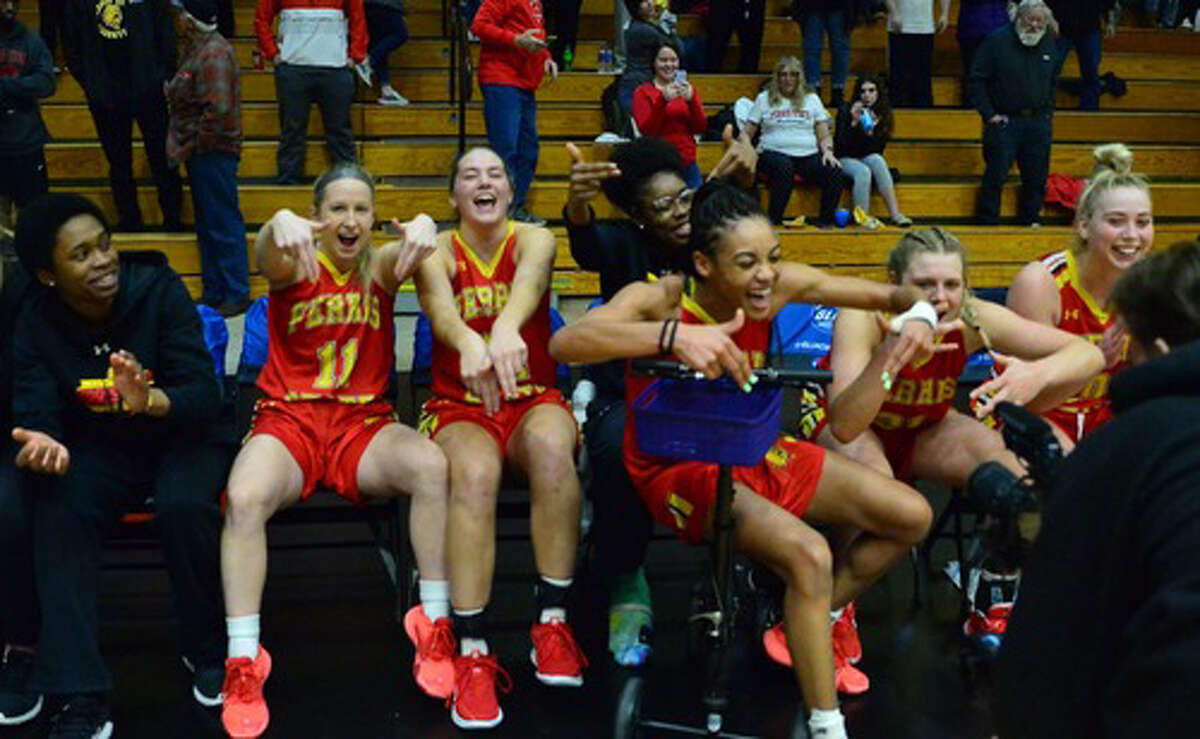 Ferris' women's basketball team celebrates its title on Sunday.