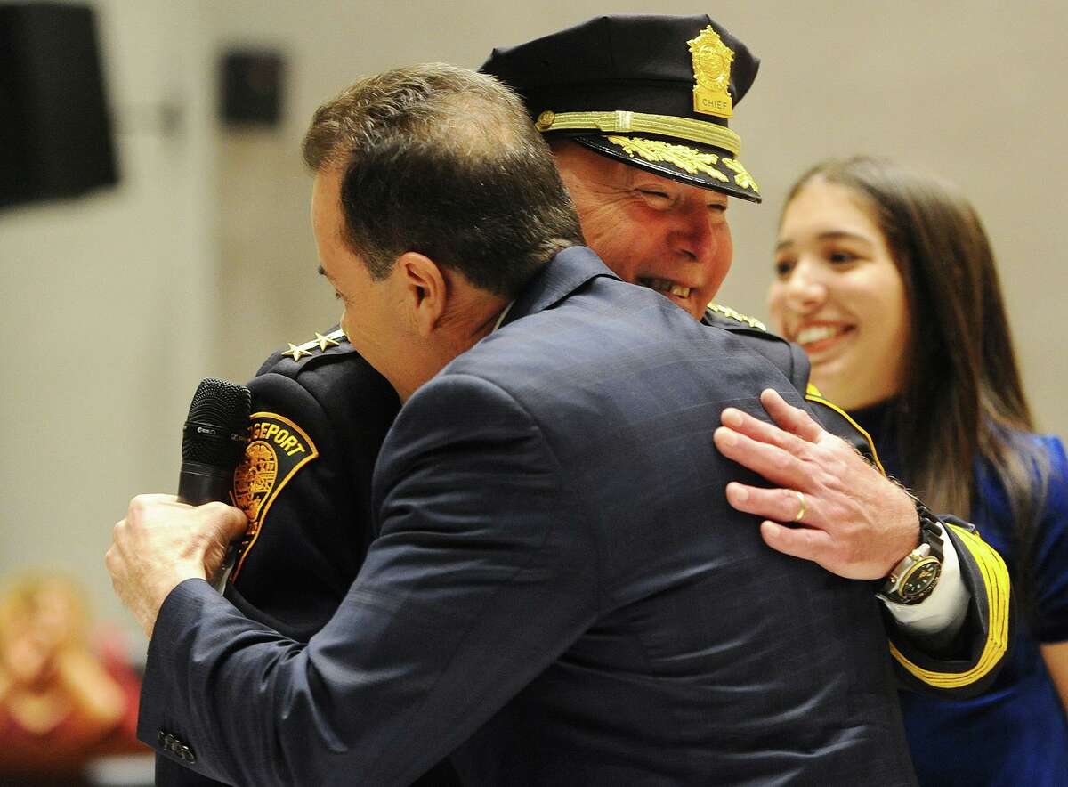 Armando "A.J." Perez hugs Bridgeport Mayor Joseph Ganim after being sworn in as Bridgeport police chief in a ceremony at City Hall in Bridgeport, Conn. on Tuesday, November 13, 2018. Perez had been acting chief for two-and-a-half years.