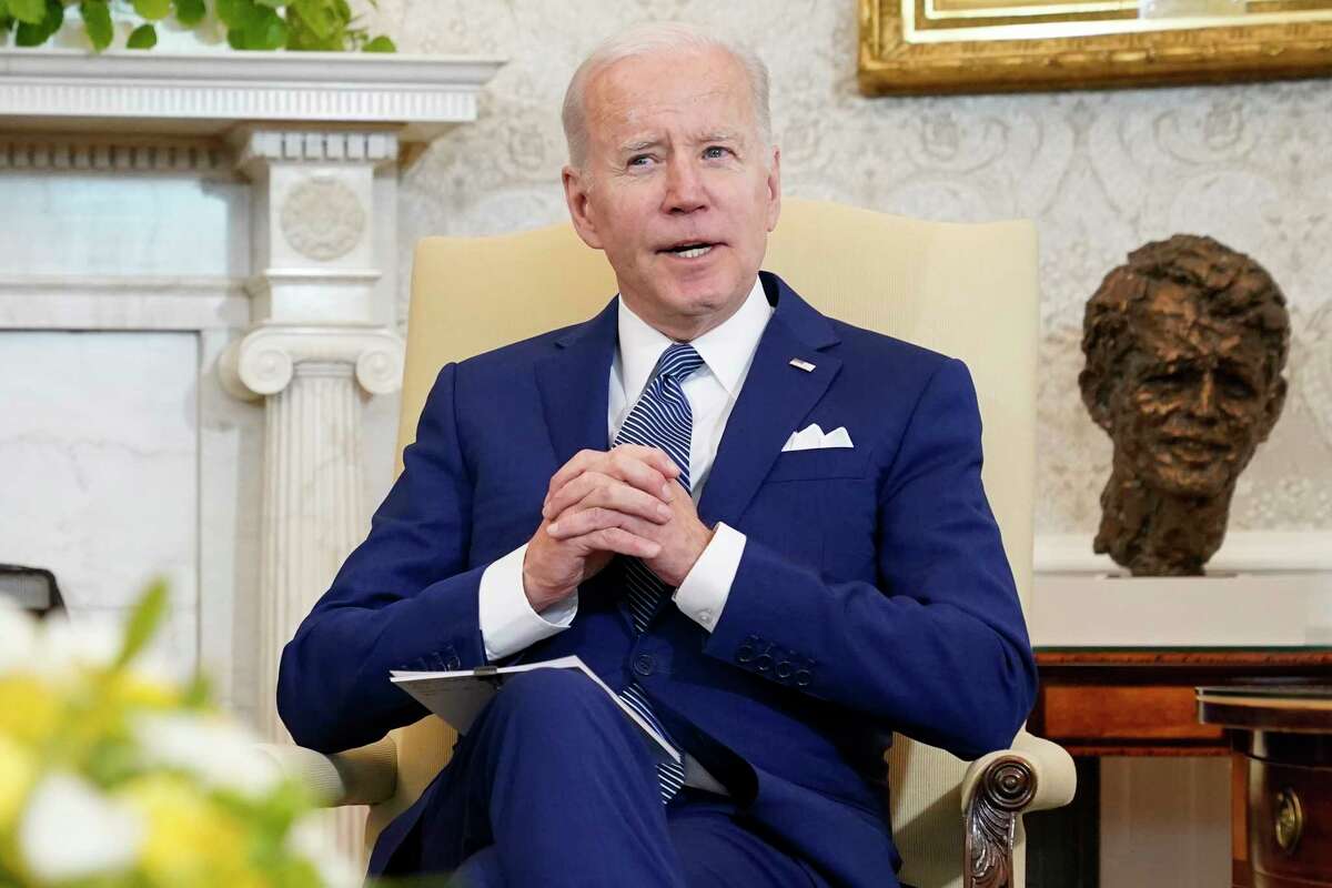 FILE - President Joe Biden sits in the Oval Office of the White House, on March 4, 2022, in Washington. Biden’s trip on Tuesday to Fort Worth, Texas, is personal. It's a chance to talk with veterans and their caregivers and push for more help for members of the military who face health problems after exposure to burn pits.