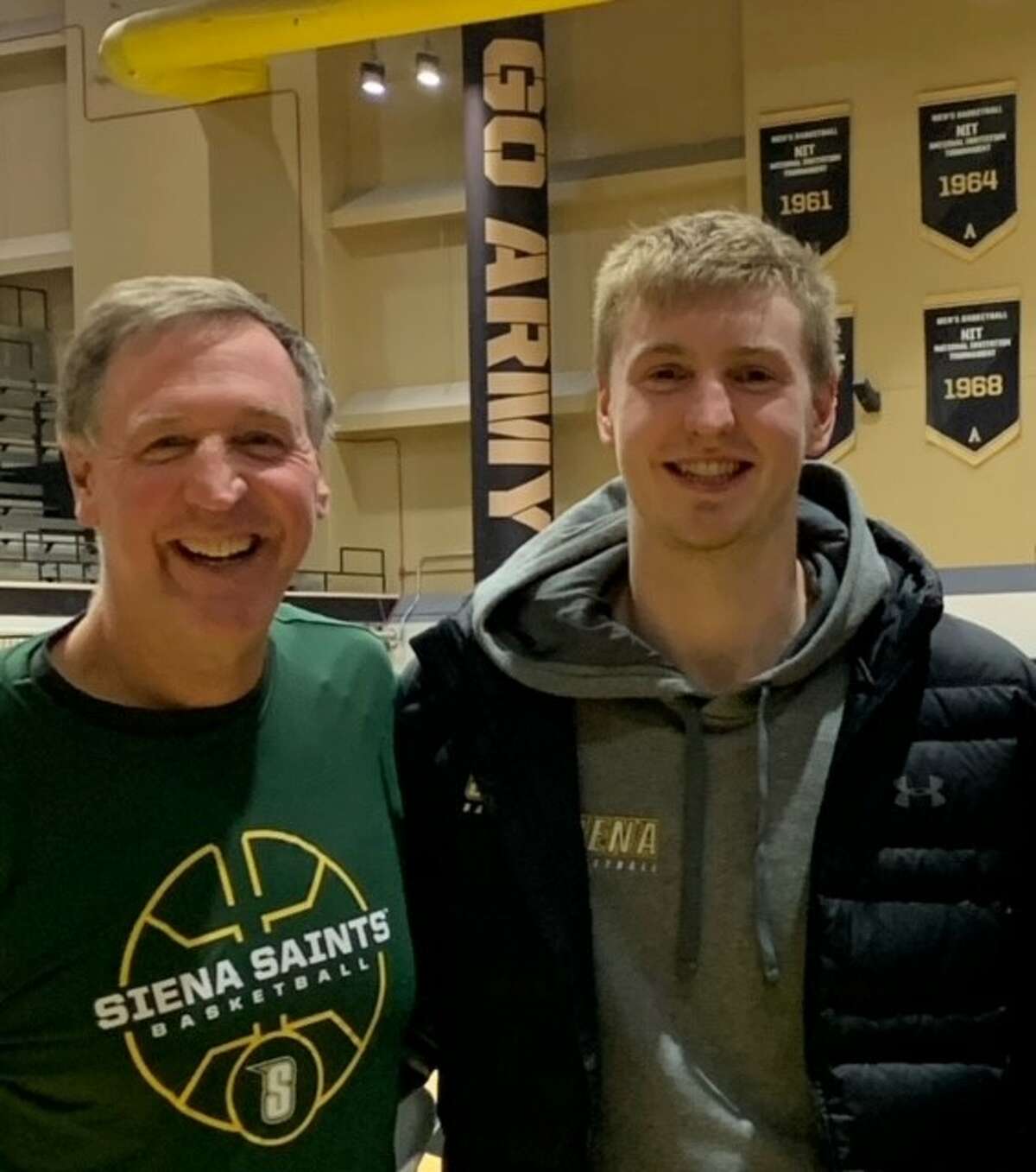 Siena graduate forward Michael Baer and his father, John, pictured together after the Saints' win at Army Nov. 30. John Baer has moved from Iowa to Saratoga Springs to attend all of his son's games. (Courtesy of John Baer)