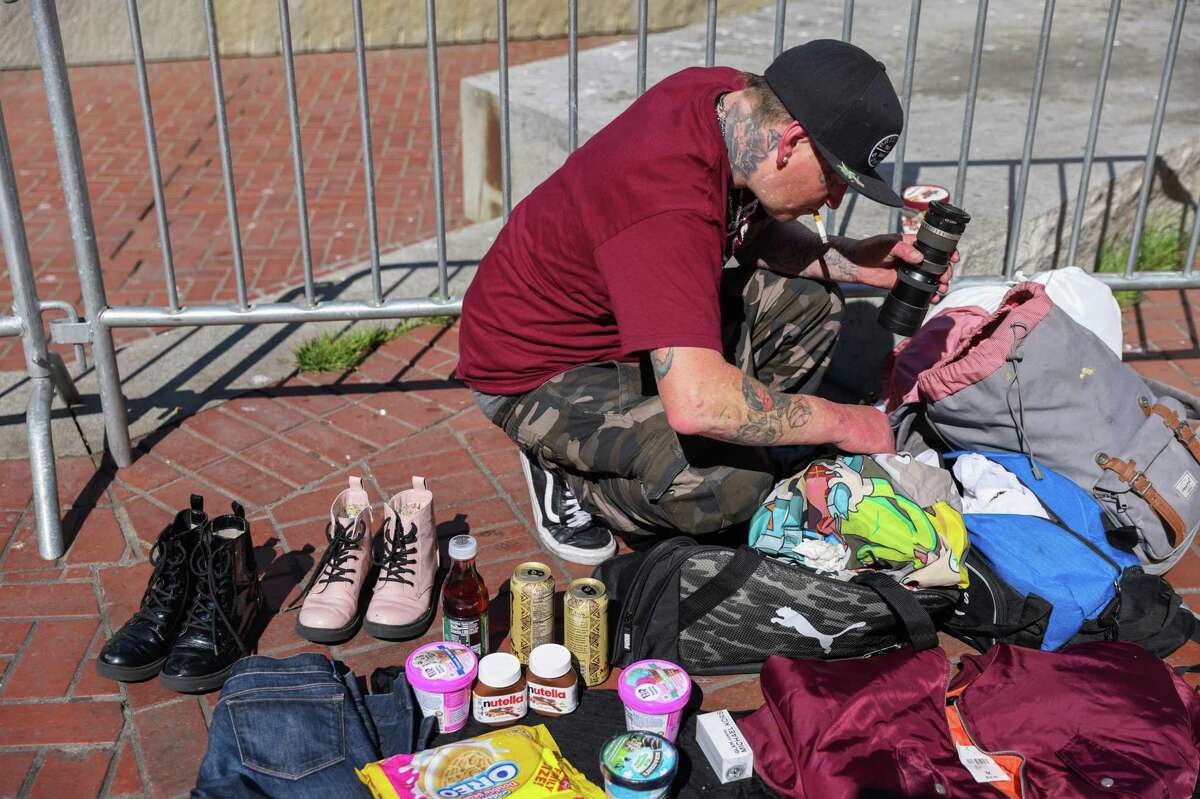 Steven Bunker sells stolen goods at UN Plaza on Monday, March 7, 2022 in San Francisco, California. Bunker said he uses the money to buy drugs.