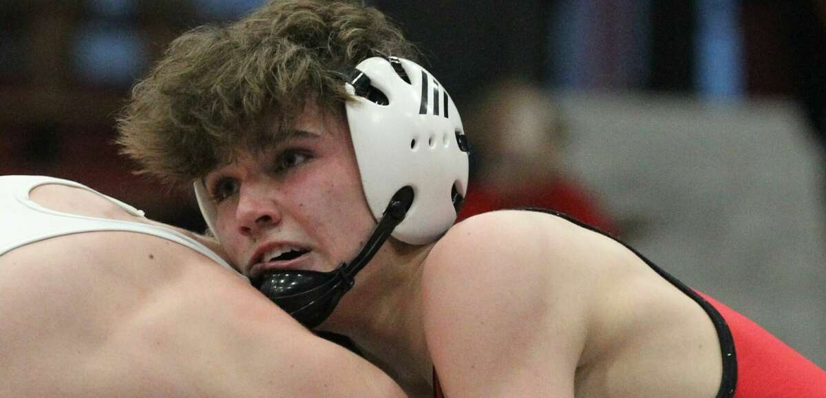A Jacksonville Middle School wrestler competes in Sectional D of the Illinois Elementary School Association State Wrestling Tournament at The JHS Bowl on Saturday