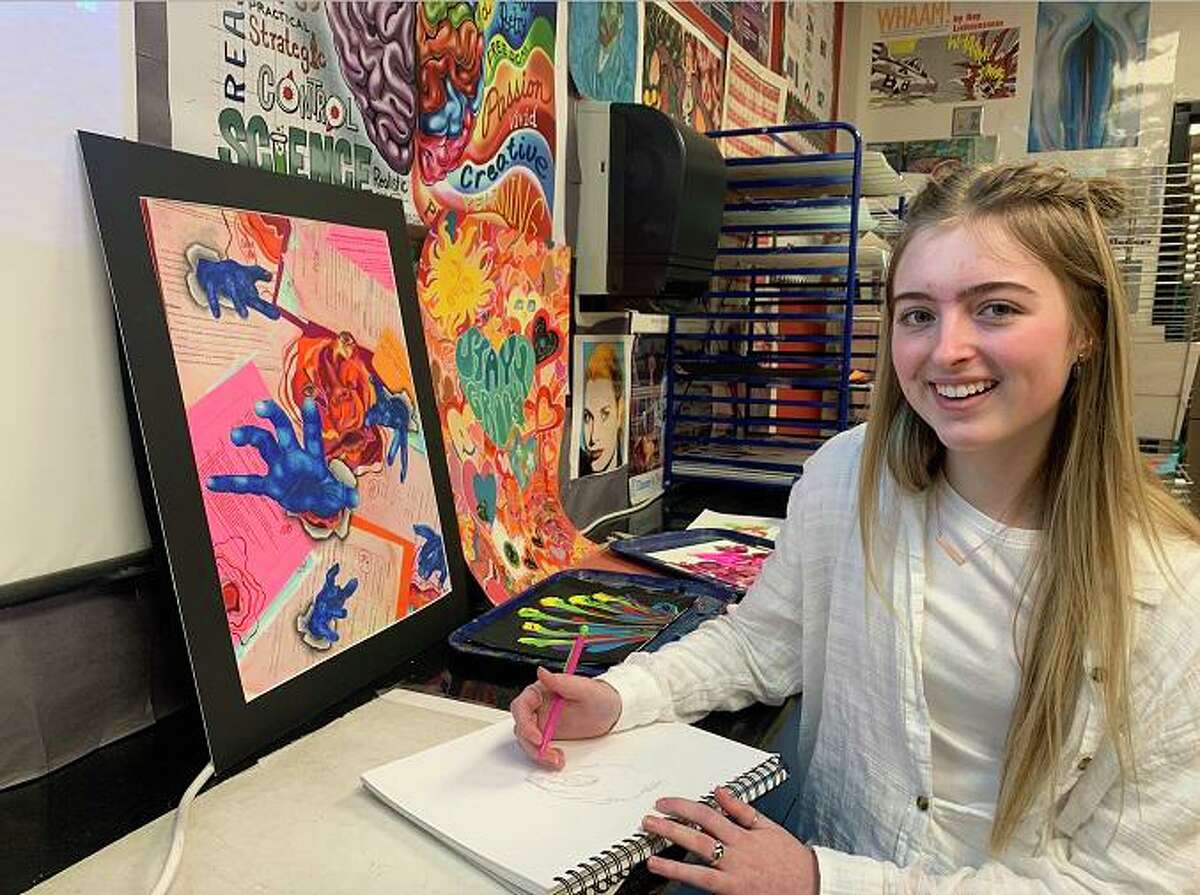 Three years after moving from New Jersey, young artist Kamryn Phillips says of Friendswood, “I love the environment. I love how friendly everyone is. In New Jersey, everyone seemed like they were always in a hurry.” Beside her is Phillips’ work, “Straight ‘A’ Student,” which recently won a gold medal in a University Interscholastic League art competition.