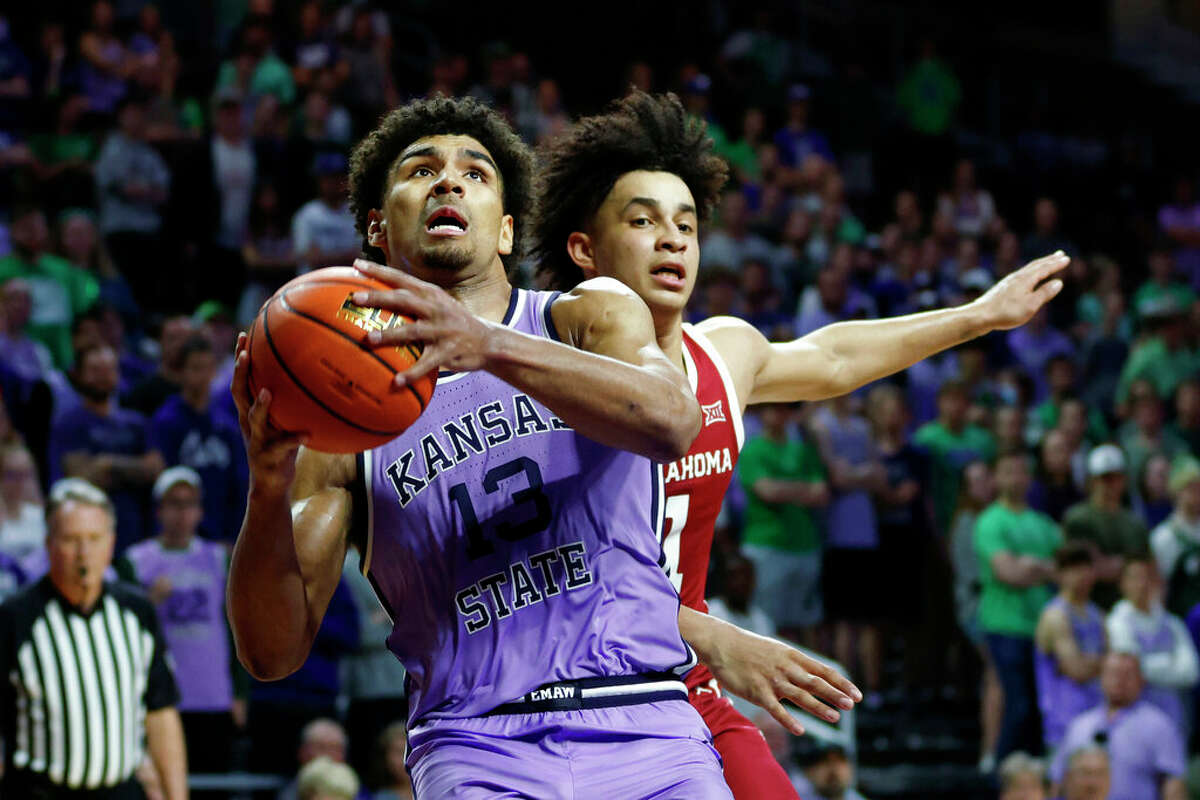 Kansas State guard Mark Smith (13) attempts to score against Oklahoma forward Jalen Hill, right, during an NCAA college basketball game on Saturday, March 5, 2022 in Manhattan, Kan. 
