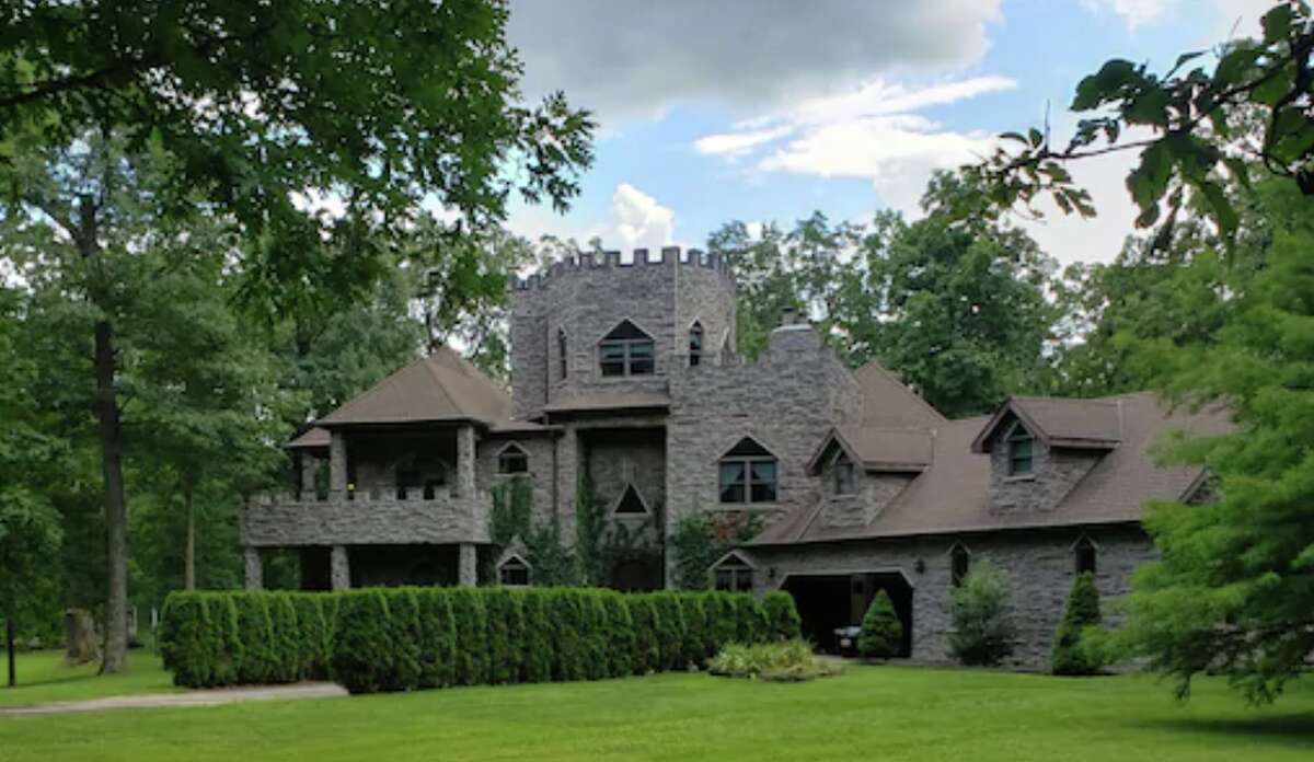 This custom castle in Central Illinois offers a five-acre lake, golf course, observatory, theater, and much more. 