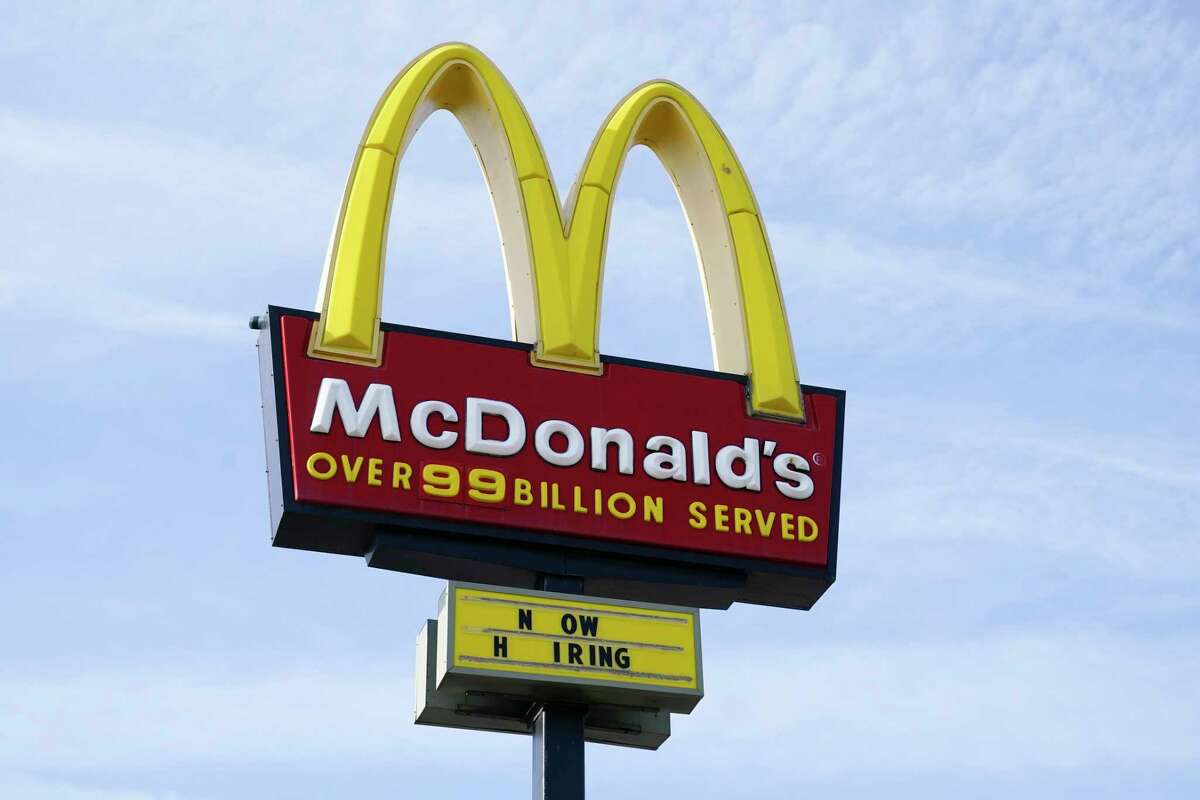 FILE - A sign is displayed outside a McDonald's restaurant, Tuesday, April 27, 2021, in Des Moines, Iowa. McDonald’s said Tuesday, March 8, 2022, it is temporarily closing all of its 850 restaurants in Russia in response to the country's invasion of Ukraine. The burger giant said it will continue paying its 62,000 employees in Russia.