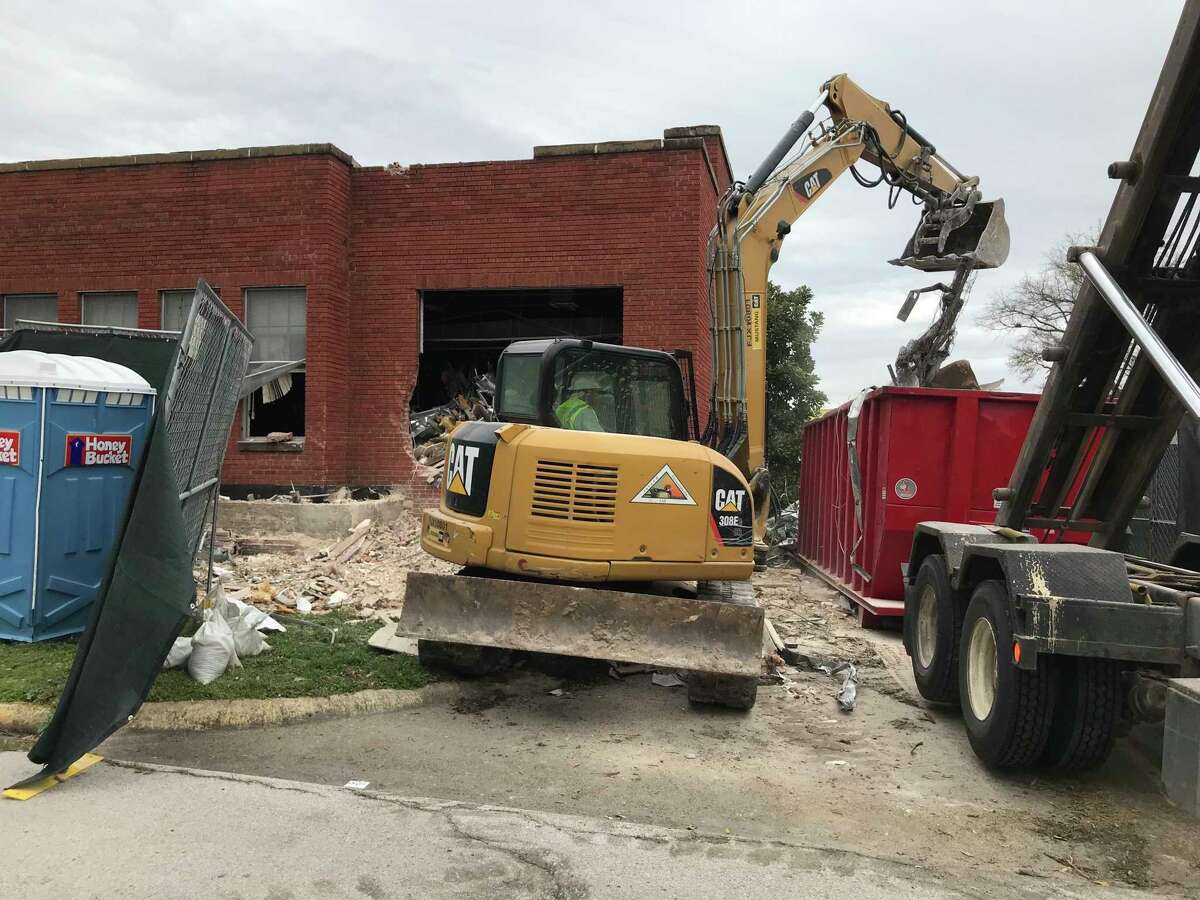 Workers begin demolishing a portion of an abandoned Texas Department of Criminal Justice warehouse in Huntsville on March 7, 2022. During the summers, the structure is home to hundreds of thousands of Mexican free-tailed bats.