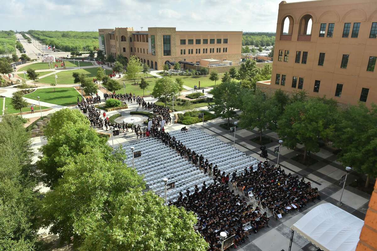 Incoming Texas A&M San Antonio freshmen take their seats after walking the "Miracle Mile" from the Torre de Esperanza to the fountain where they were greeted by upperclassmen, faculty and staff. Bexar County officials on Tuesday committed $10 million to fund athletic fields and a track on campus, noting that South Side residents will be able to use the facilities to exercise.