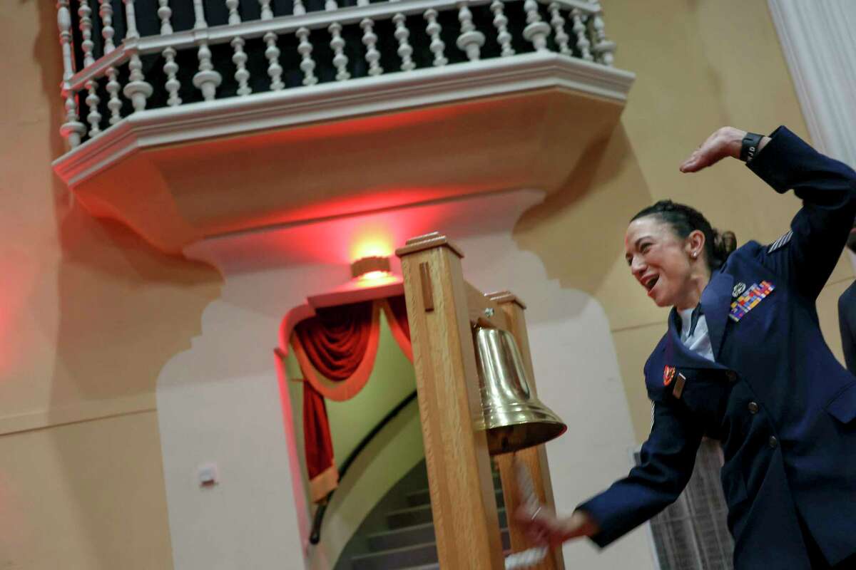 Tech. Sgt. Rebecca Absher from Buckley Space Force Base, excitedly rings the bell at Tuesday’s annual Operation Blue Suit Ceremony held at JBSA-Randolph. The Air Force recognizes its top recruiters at the event.