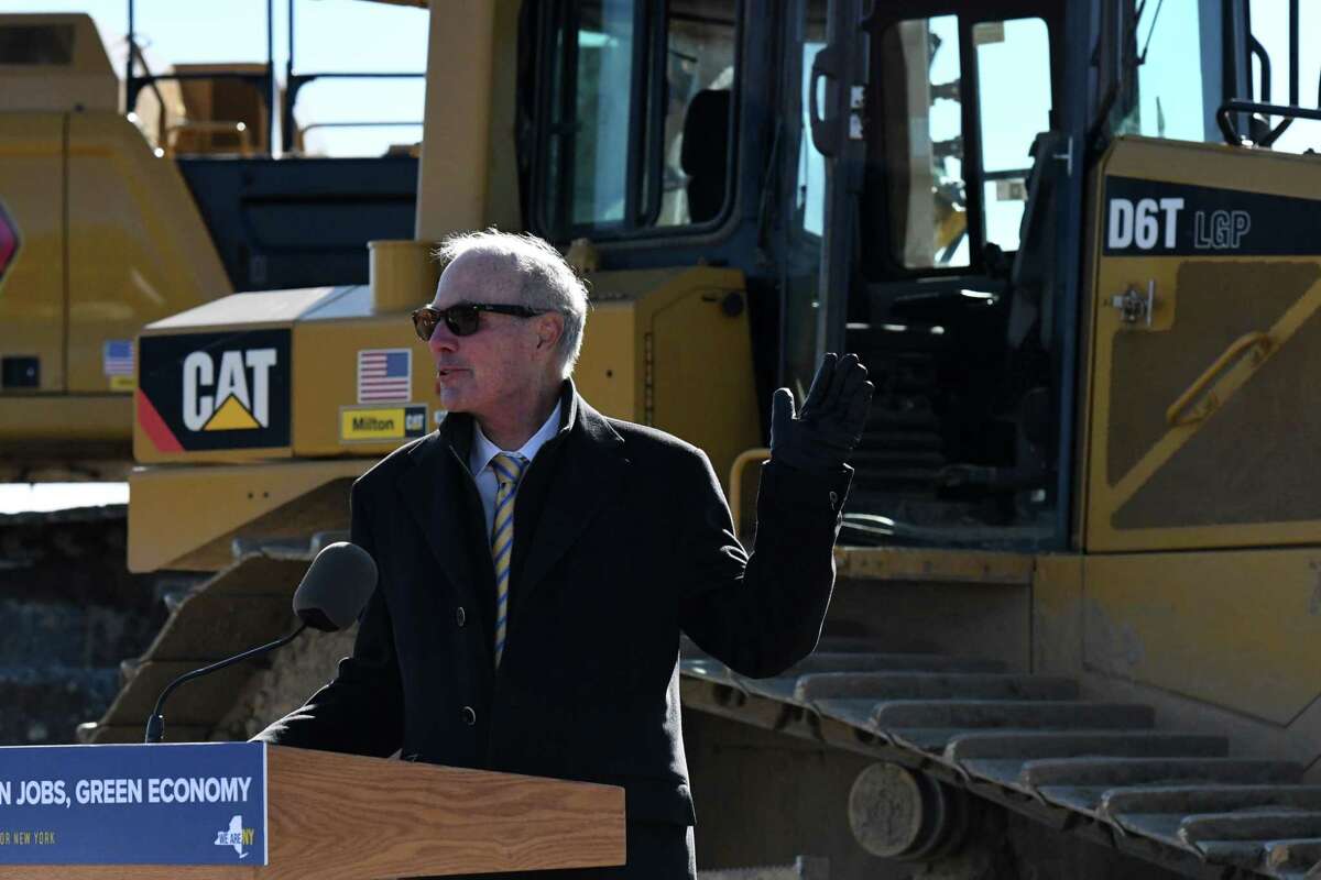 Plug Power CEO Andy Marsh speaks to guests during a groundbreaking of the company's new factory in Slingerands with Gov. Kathy Hochul in March. Plug Power reported it awarded more than $50 million in compensation to Marsh in 2021, although Marsh can only realize that if he can get the company's stock to $100 per share. Plug Power currently trades around $13 per share.