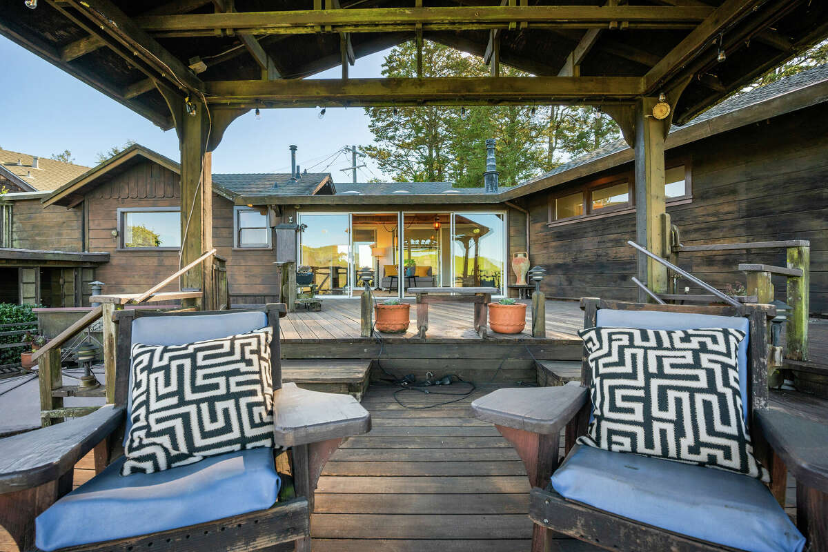 Looking back at the house from the deck, we see the home's unique geometry and ideal setting for taking in the hilltop vistas. 