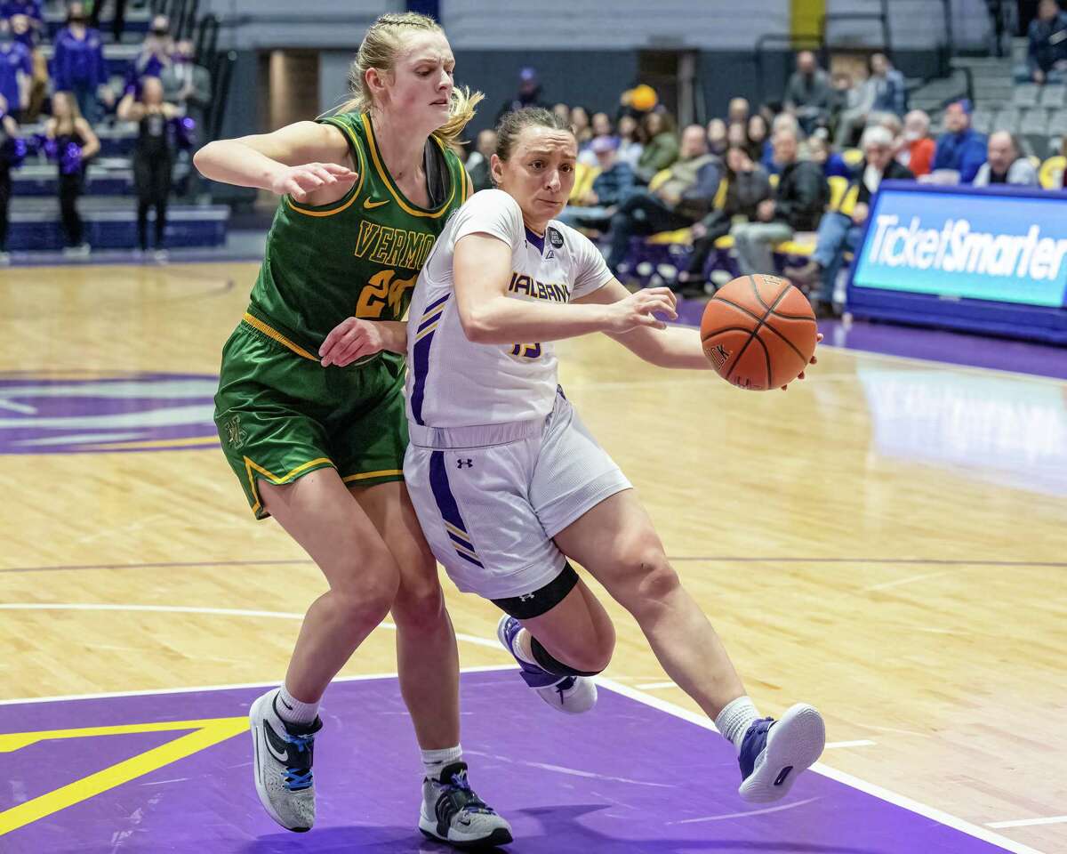 UAlbany sophomore Morgan Haney drives to the basket in front of Vermont sophomore Anna Olson during the America East Conference semifinals at the SEFCU Arena on the UAlbany campus on Tuesday, March 8, 2022. (Jim Franco/Special to the Times Union)