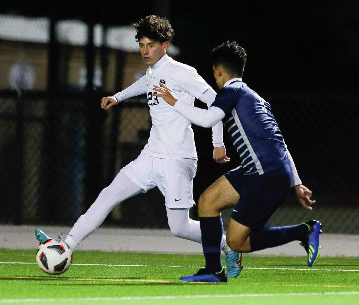 Conroe’s Julian Vega (23) dribbles the ball in the first period of a District 13-6A high school soccer match at Woodforest Bank Stadium, Tuesday, March 8, 2022, in Shenandoah.