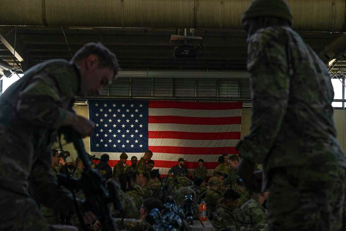 Troops at Fort Bragg in North Carolina prepare to deploy to Eastern Europe on Monday, Feb. 14, 2022.