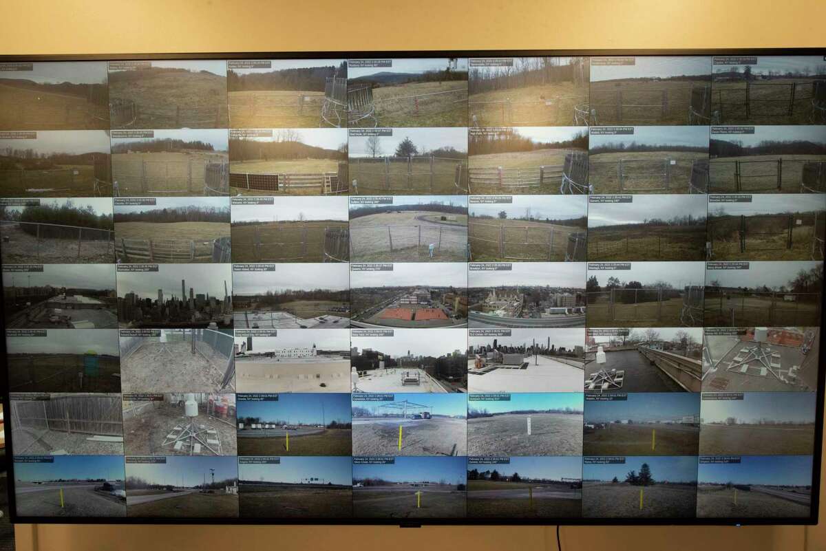 Footage from weather cameras from around the state are seen on giant screes in the operations center at University at Albany ETEC building on Thursday, Feb. 24, 2022 in Albany, N.Y.